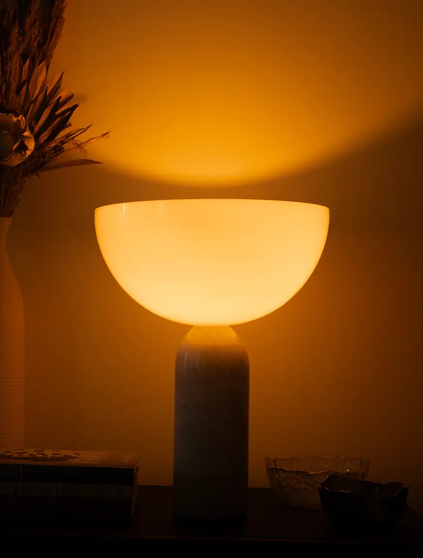 Arc Marble Table Lamp glowing against wall with soft upward light spread