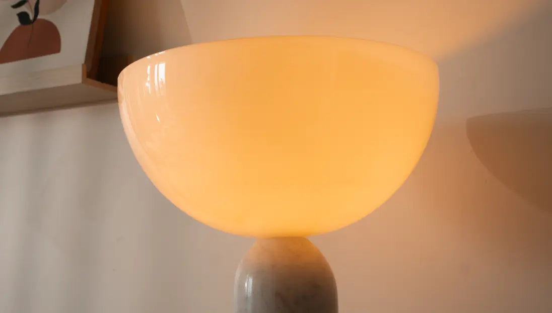 Glossy dome shade of Arc Marble Table Lamp radiating warm, soft ambient light