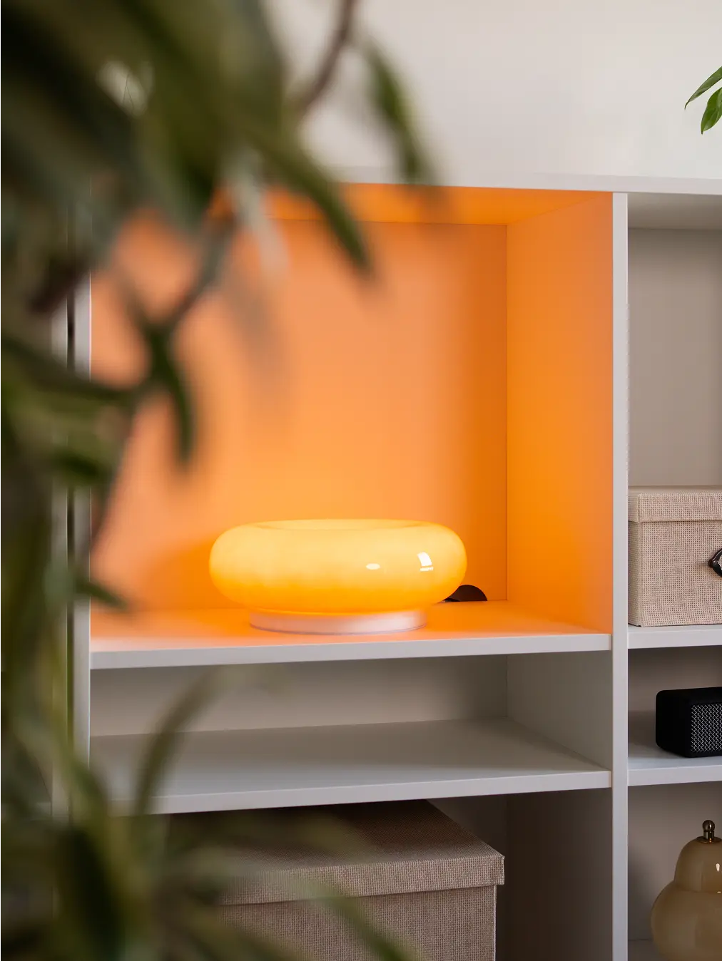 Donut Glass Lamp emitting a soft warm glow, perfect for creating a cozy ambiance in living spaces.