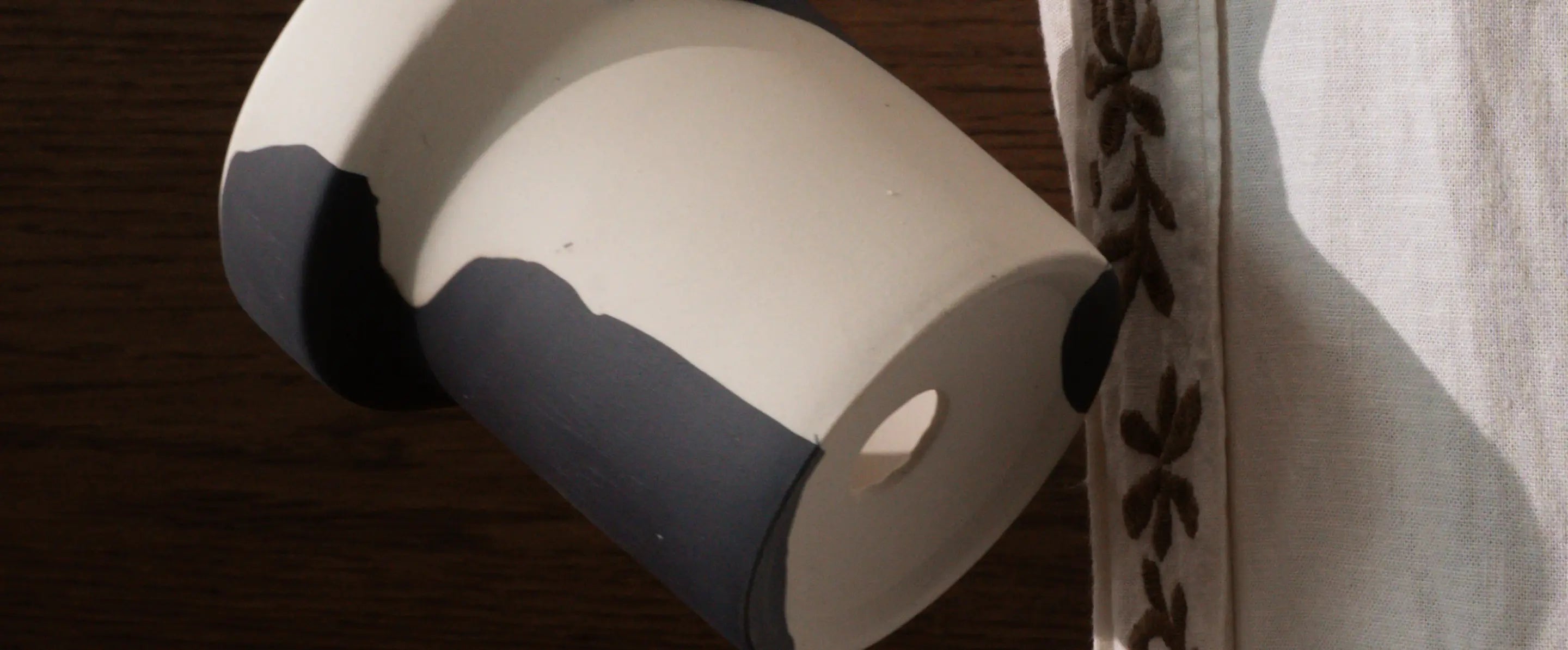 Dune Ceramic Planter showing handcrafted base design with drainage hole underside.