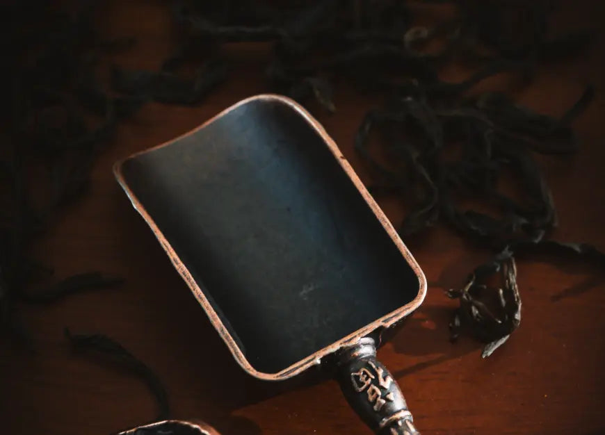 Close-up of a Vintage Spoon with a rustic, aged finish and a textured scoop.