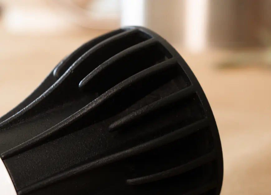Close-up detail of black textured cooling fins on Blaze 12W LED Grow Light.