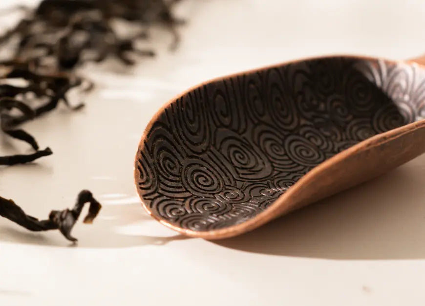 Close-up of the Vintage Spoon’s engraved swirl design, highlighting its intricate craftsmanship.