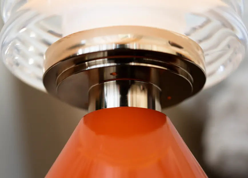 Detailed view of Dusk Table Lamp’s ribbed glass shade and polished metal frame