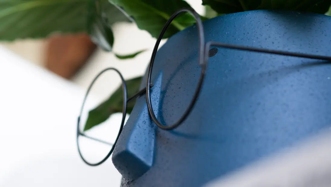 Side profile of the Jojo Ceramic Planter, focusing on its sculpted nose and curved glasses frame.