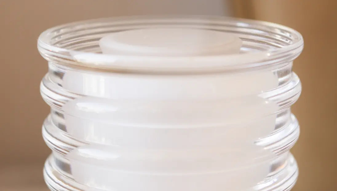 Close-up of the Dusk Table Lamp’s ribbed glass shade, highlighting its modern and high quality design.