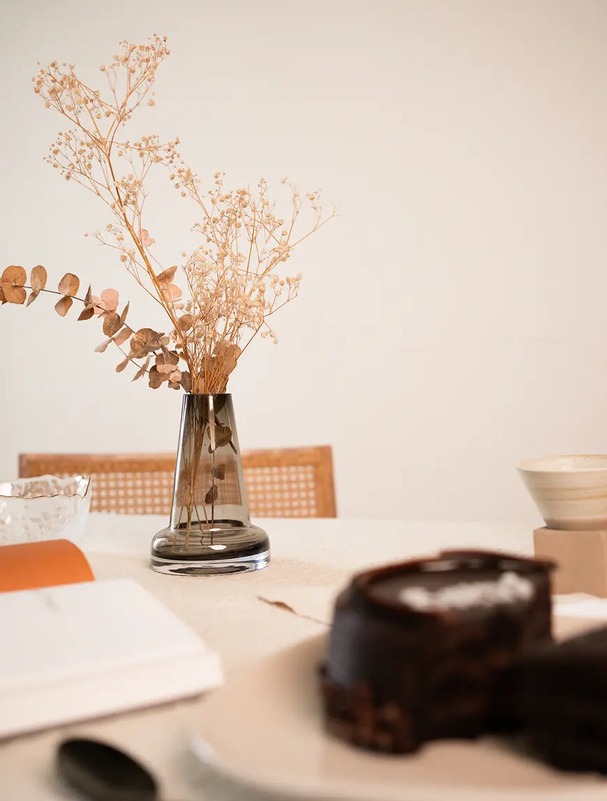 Elegant Pitcher Glass Vase - Long Neck with dried florals on a dining table, styled with warm-toned decor.
