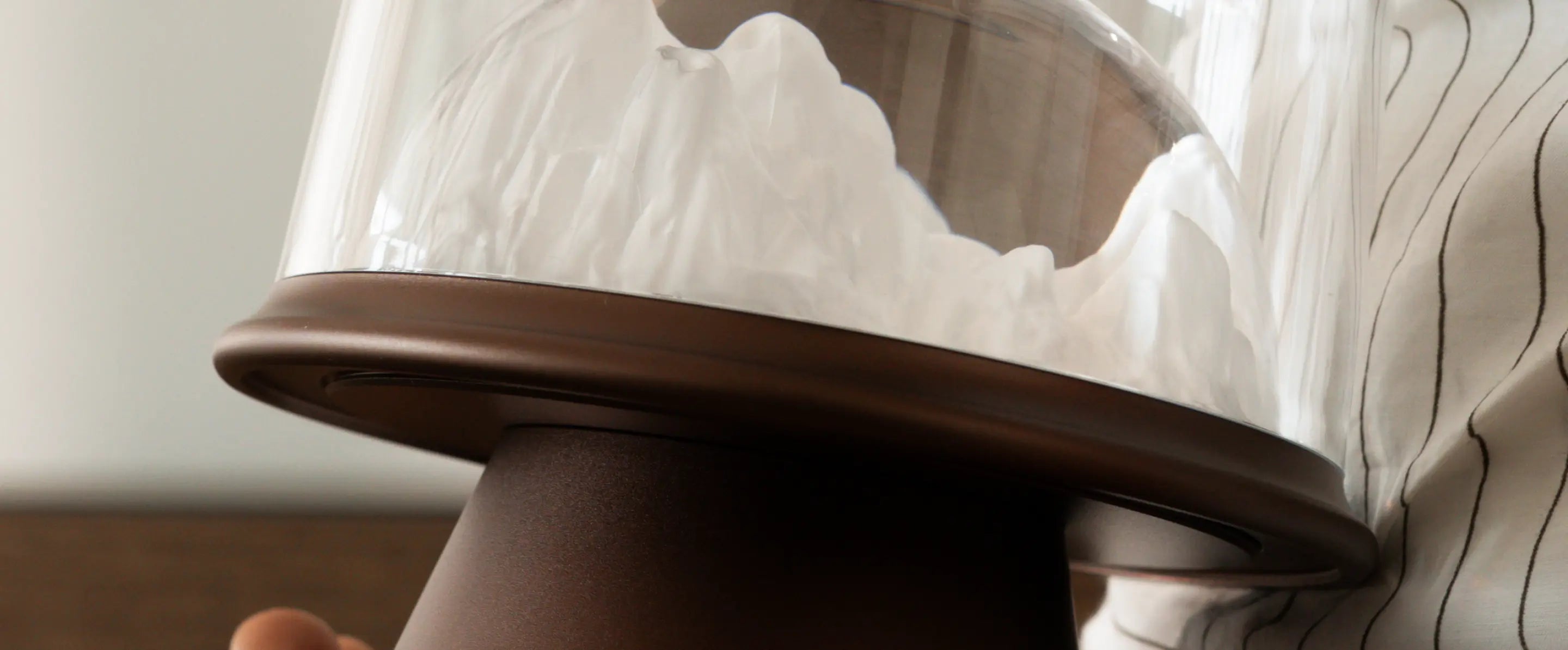 Close-up of a Frozen Table Lamp with a glass shade on a neutral background