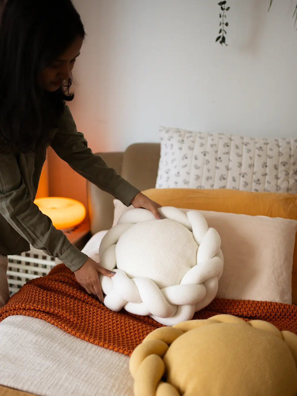 Gharko white nest cushion placed on cozy bed setup