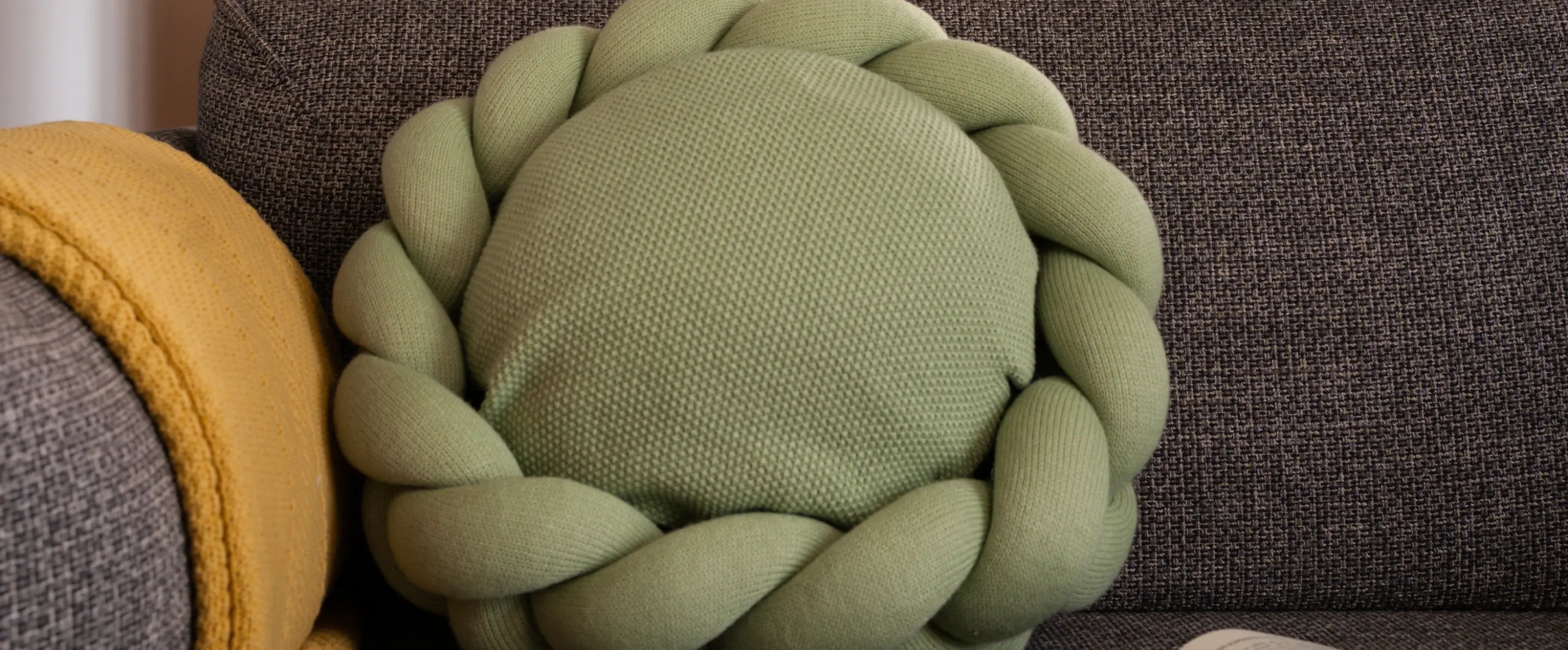 Front view of Gharko Halo Nest Cushion Green highlighting circular knit cushion