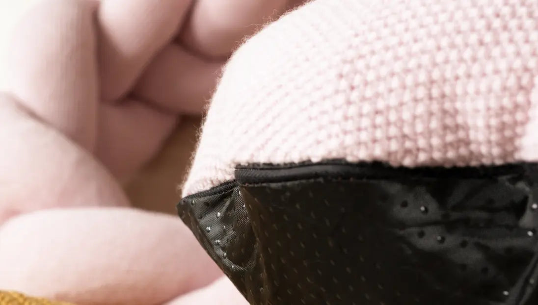 Non-slip black base of Gharko pink Halo Nest Cushion in close-up