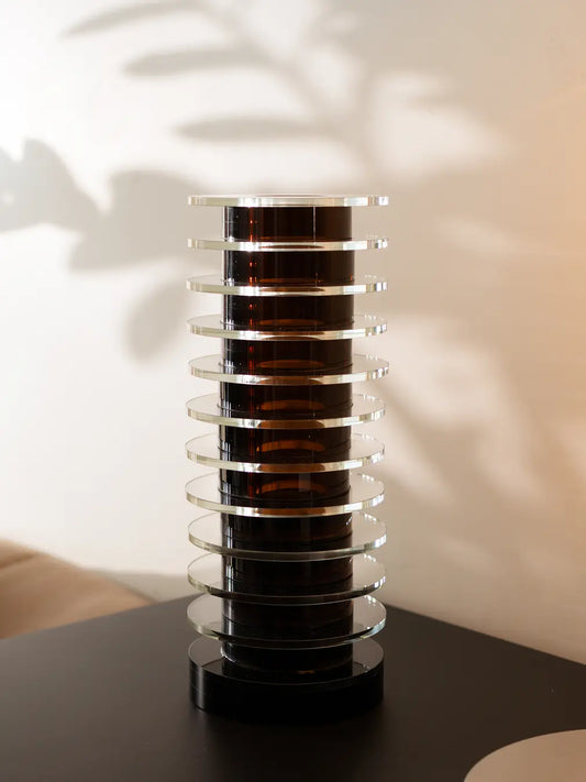 Helix Glass Vase styled on a black table with soft ambient lighting and modern shadow play