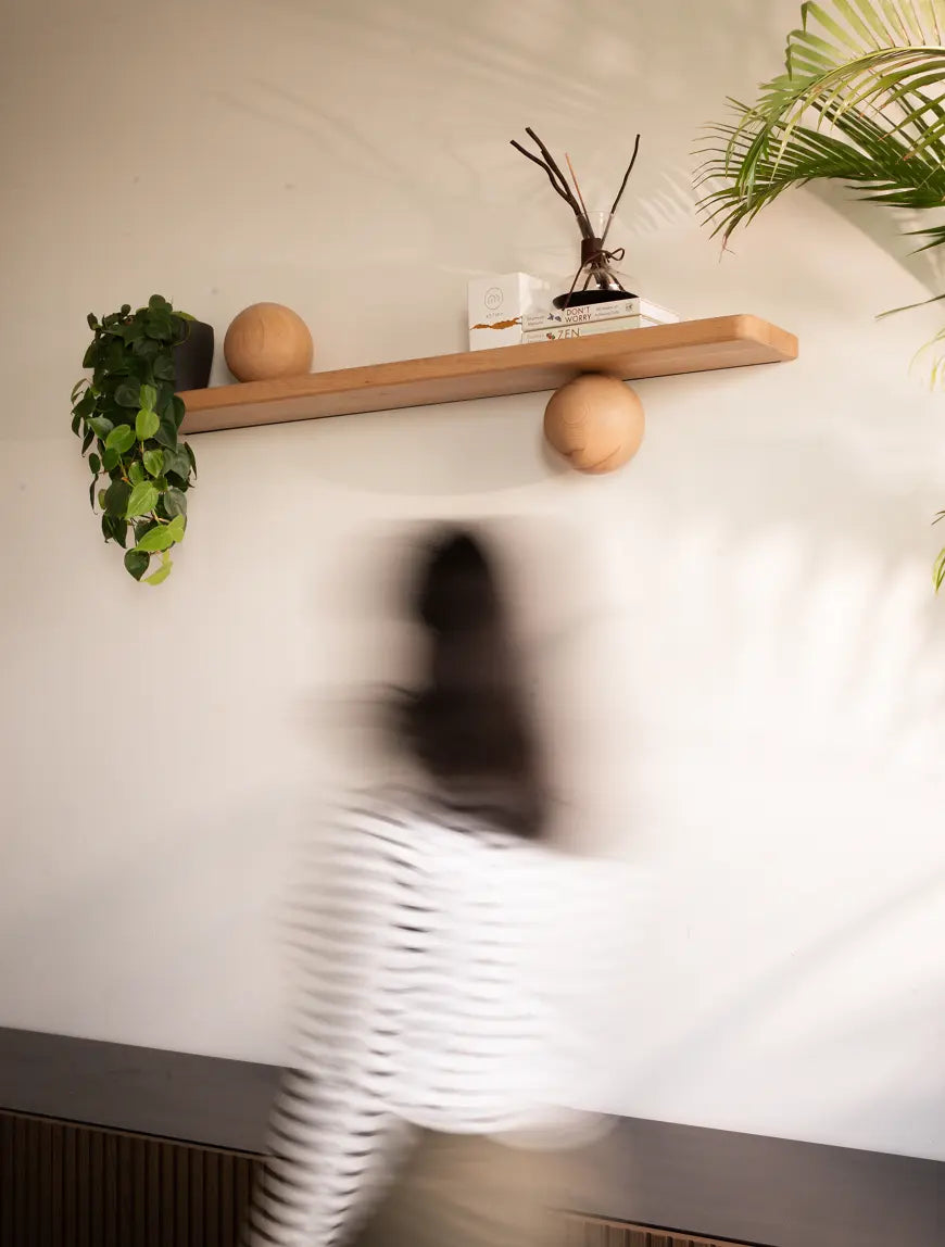 Orb Wooden Floating Wall Shelf styled in a modern interior space