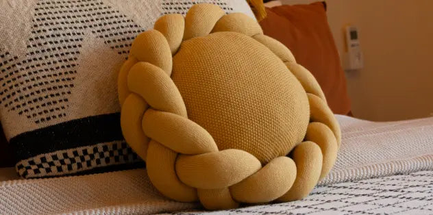 yellow round cushion with braided edge – modern home furnishing pillow for bed decor
