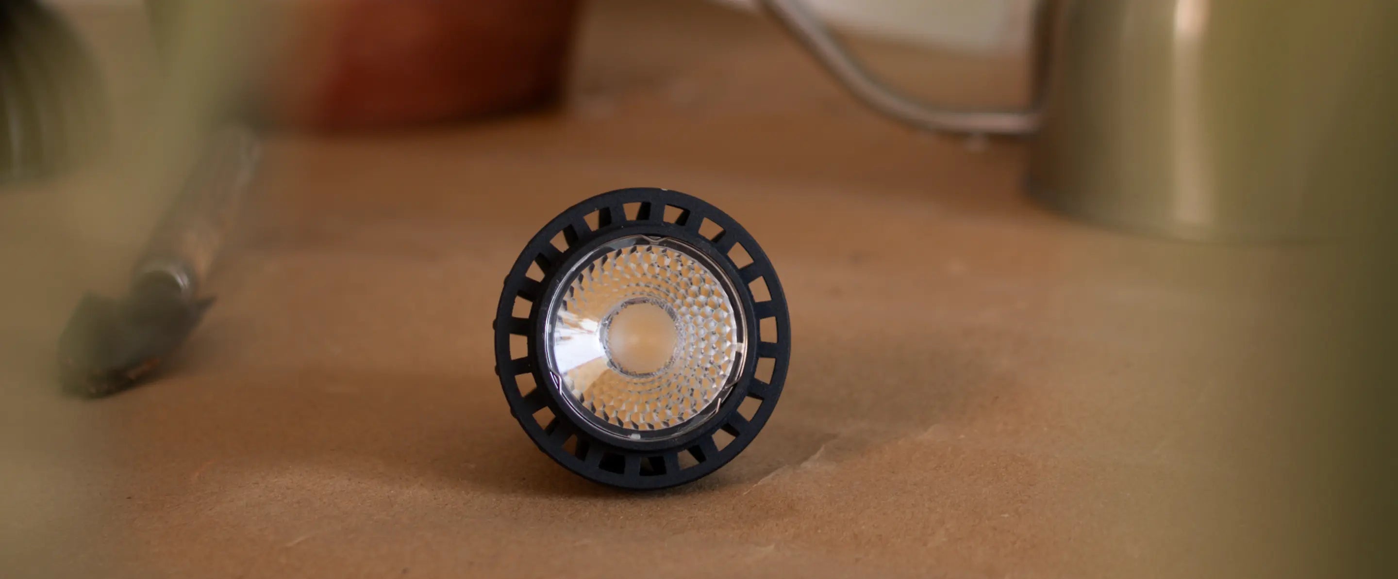 Blaze 12W LED Grow Light lens detail with minimalist black frame on table.