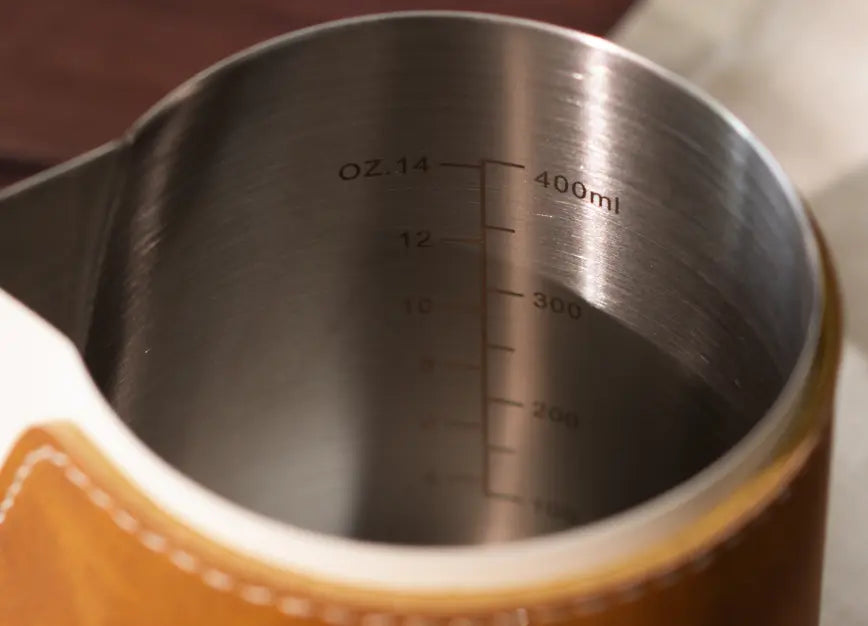 Interior view of the Brista Milk Pitcher, featuring a 400ml stainless steel body with precise measurement markings.