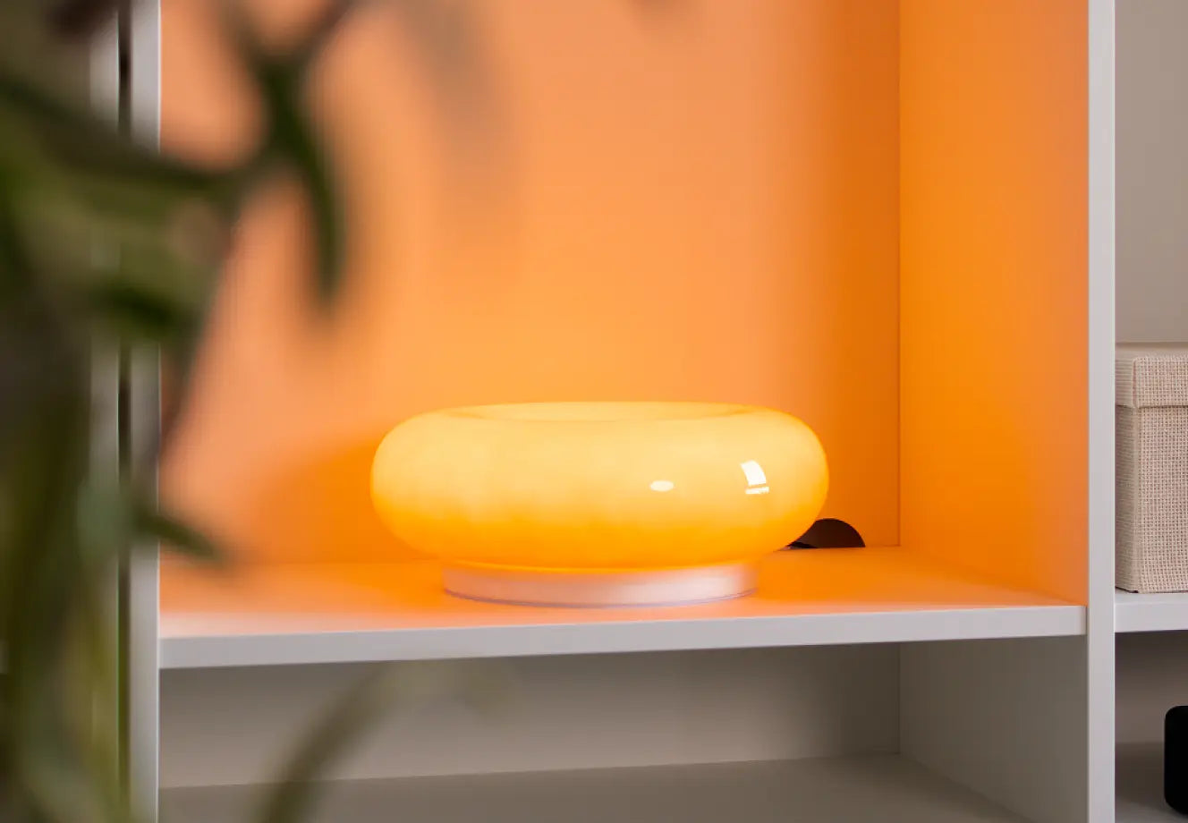 Donut glass viral lamp glowing warm light on shelf in modern home decor