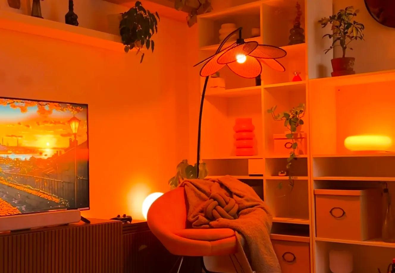 Cozy living room with warm mood lighting, ambient glow, and decorative floor lamp creating a relaxed home atmosphere.