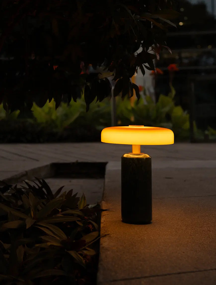 Alba Moss Marble Table Lamp used outdoors, showcasing its cordless portable design