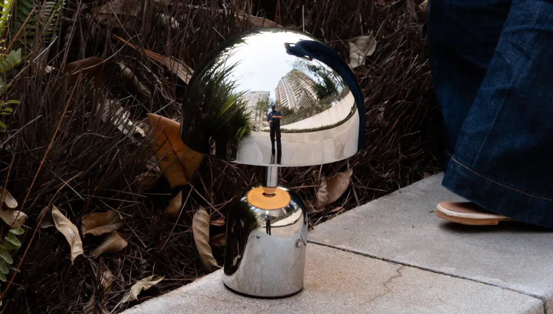 Bell Portable Table Lamp on stone ledge with LED light