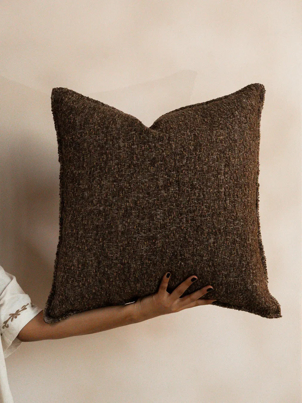Square jacquard cushion cover showing clean edges and structured modern form
