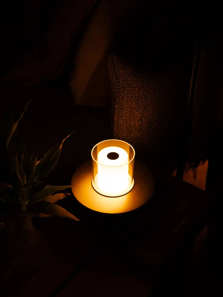 Candle portable table lamp with warm glow creating cozy ambient lighting setup