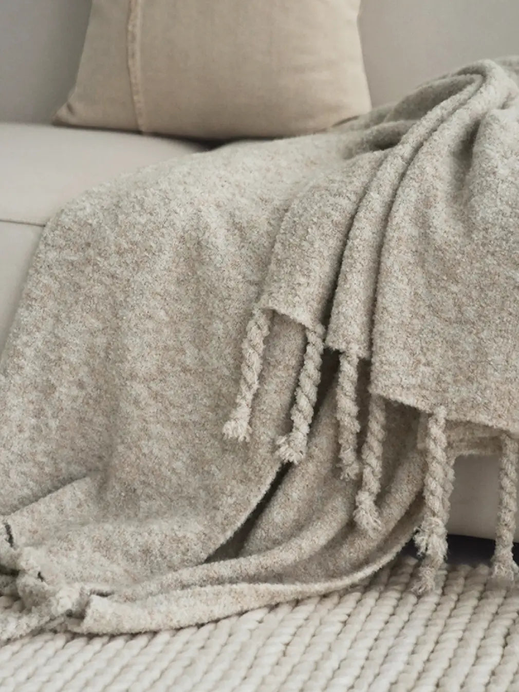 Close-up of cloud-soft wool throw fabric highlighting plush texture and warmth