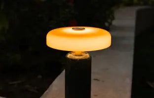 wireless lamp with a warm glow on a stone surface