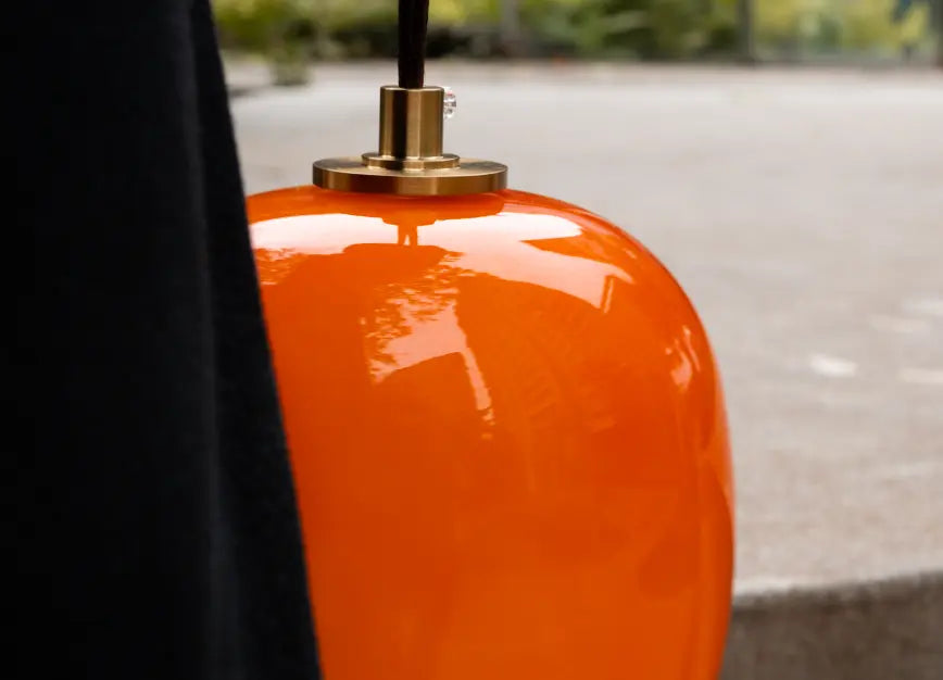Orange Dew rechargeable glass table lamp with gold metal top detail