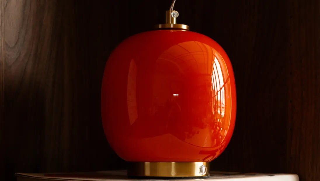 Orange Dew portable glass table lamp with glossy finish and gold base
