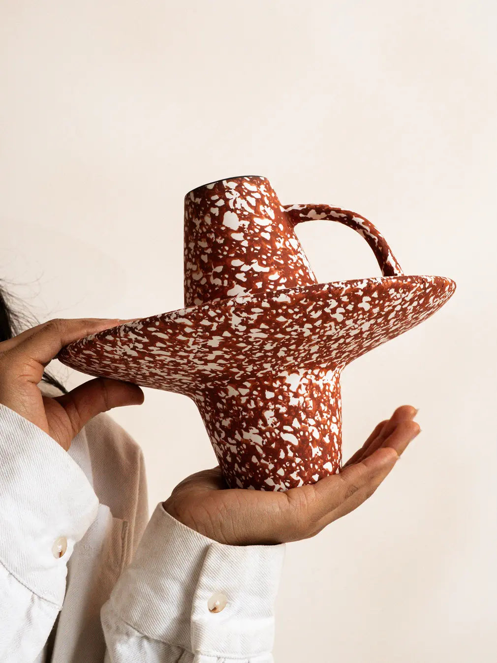 Handcrafted bohemian ceramic vase with wide disc base and sculptural form