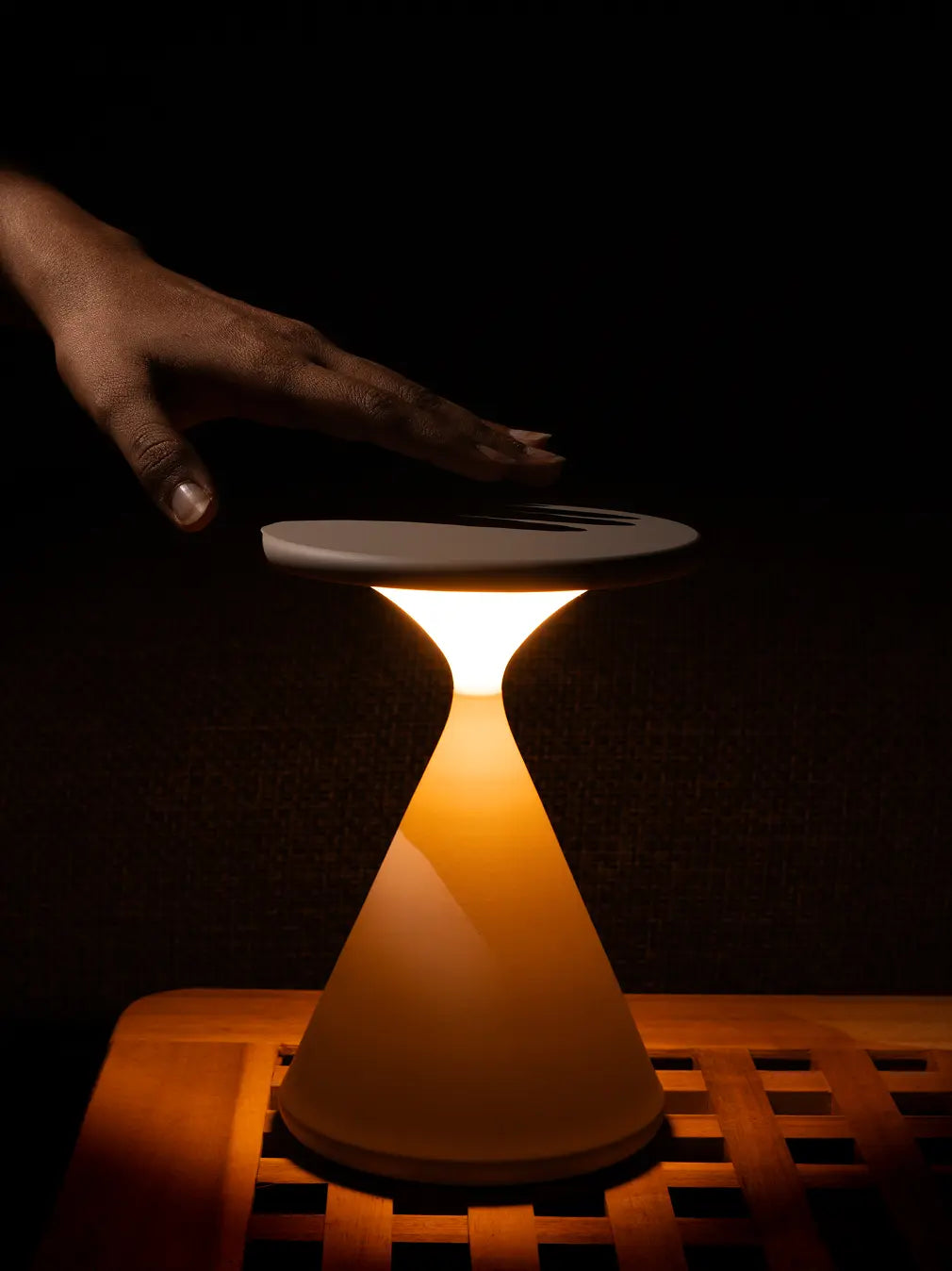 Flux Portable Table Lamp glowing indoors with touch control for warm ambient lighting