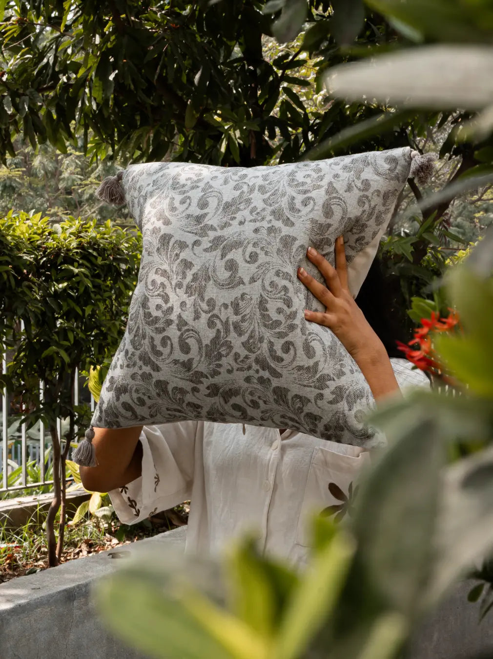 Premium botanical cushion cover styled in garden setting for home decor use