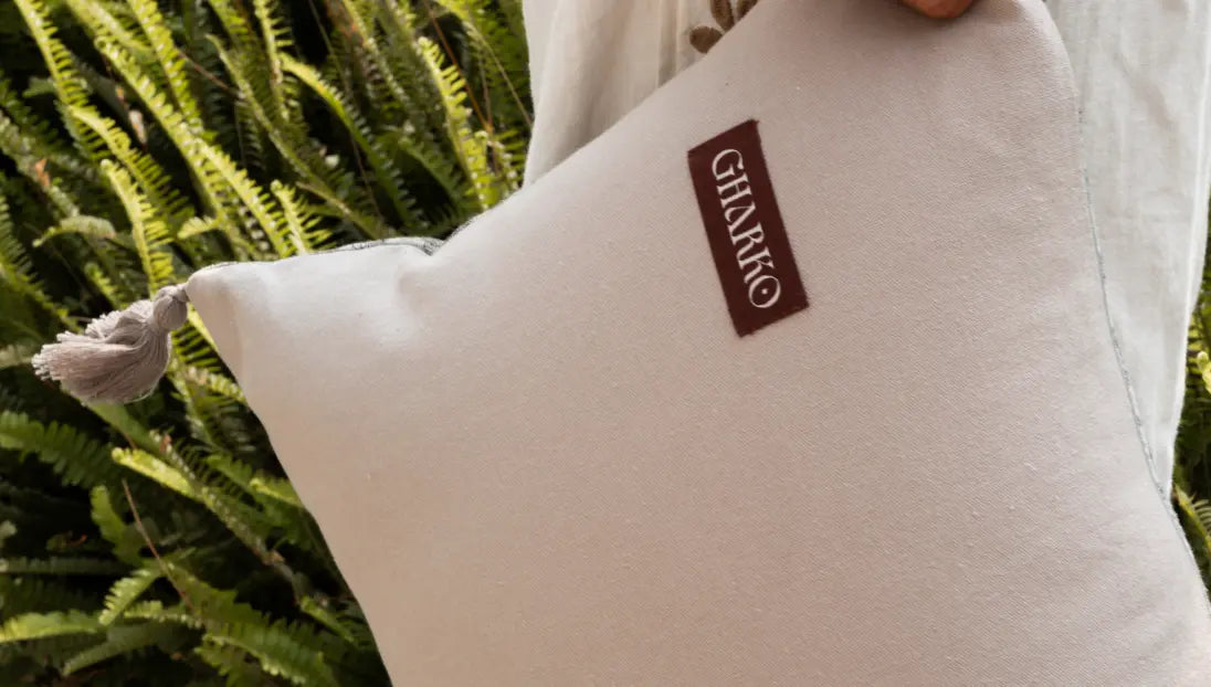 Back side plain fabric with Gharko label on premium cushion cover