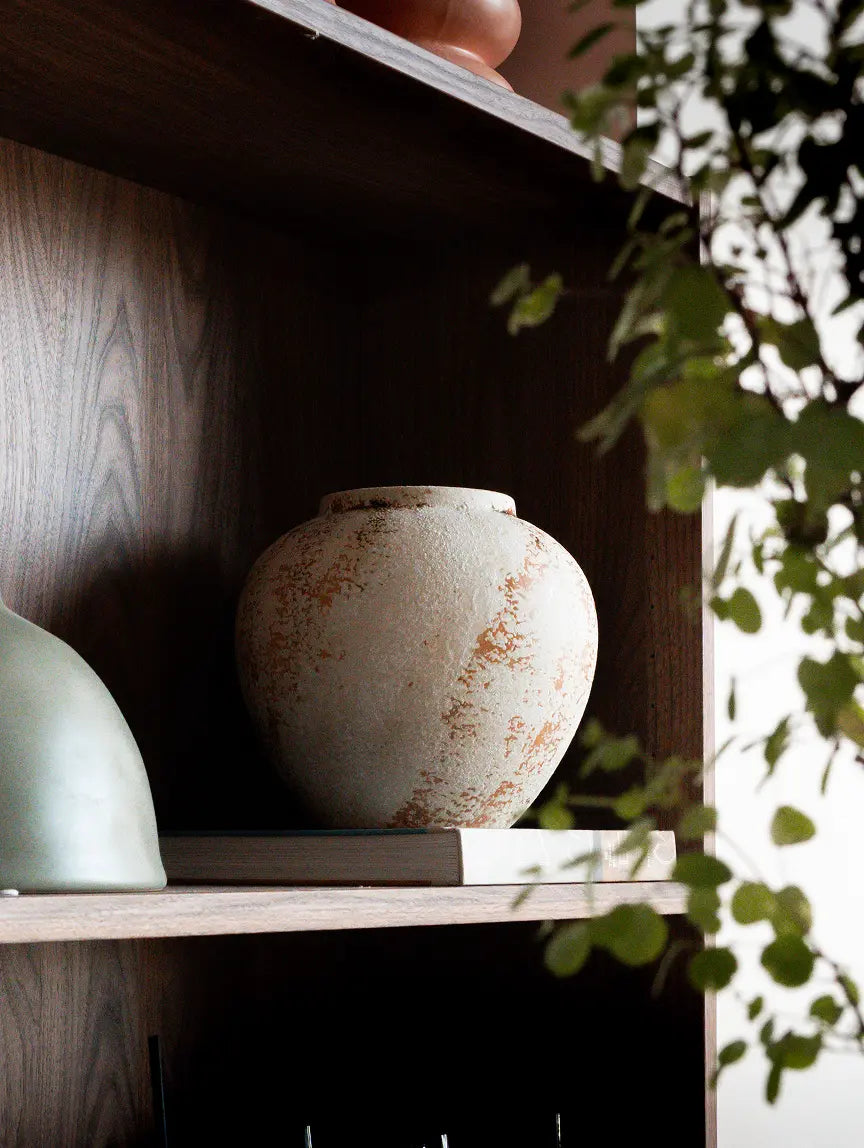 Gaia ceramic vase with organic wabi-sabi texture styled on wooden shelf
