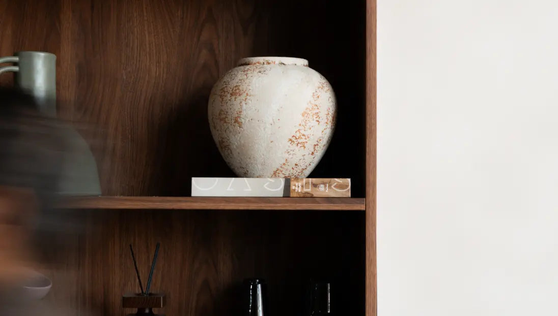 Rustic Gaia ceramic flower vase used as sculptural decor in modern interior setting