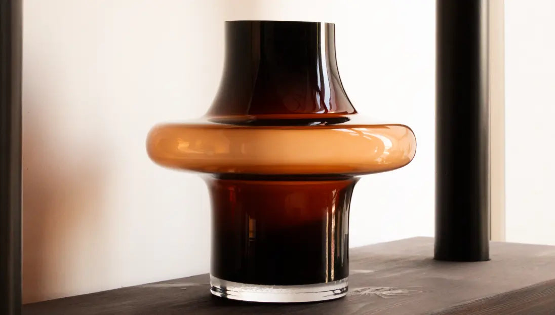 Halo Amber Glass Vase Small styled on dark wooden shelf for warm, modern living room decor.