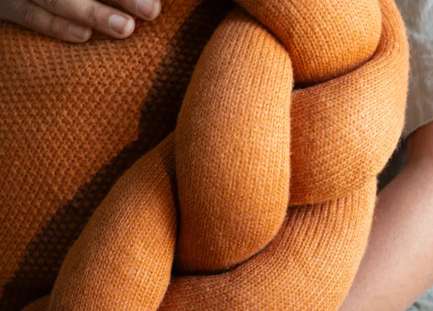 Close-up of braided wool detailing on Halo Nest Cushion in mustard