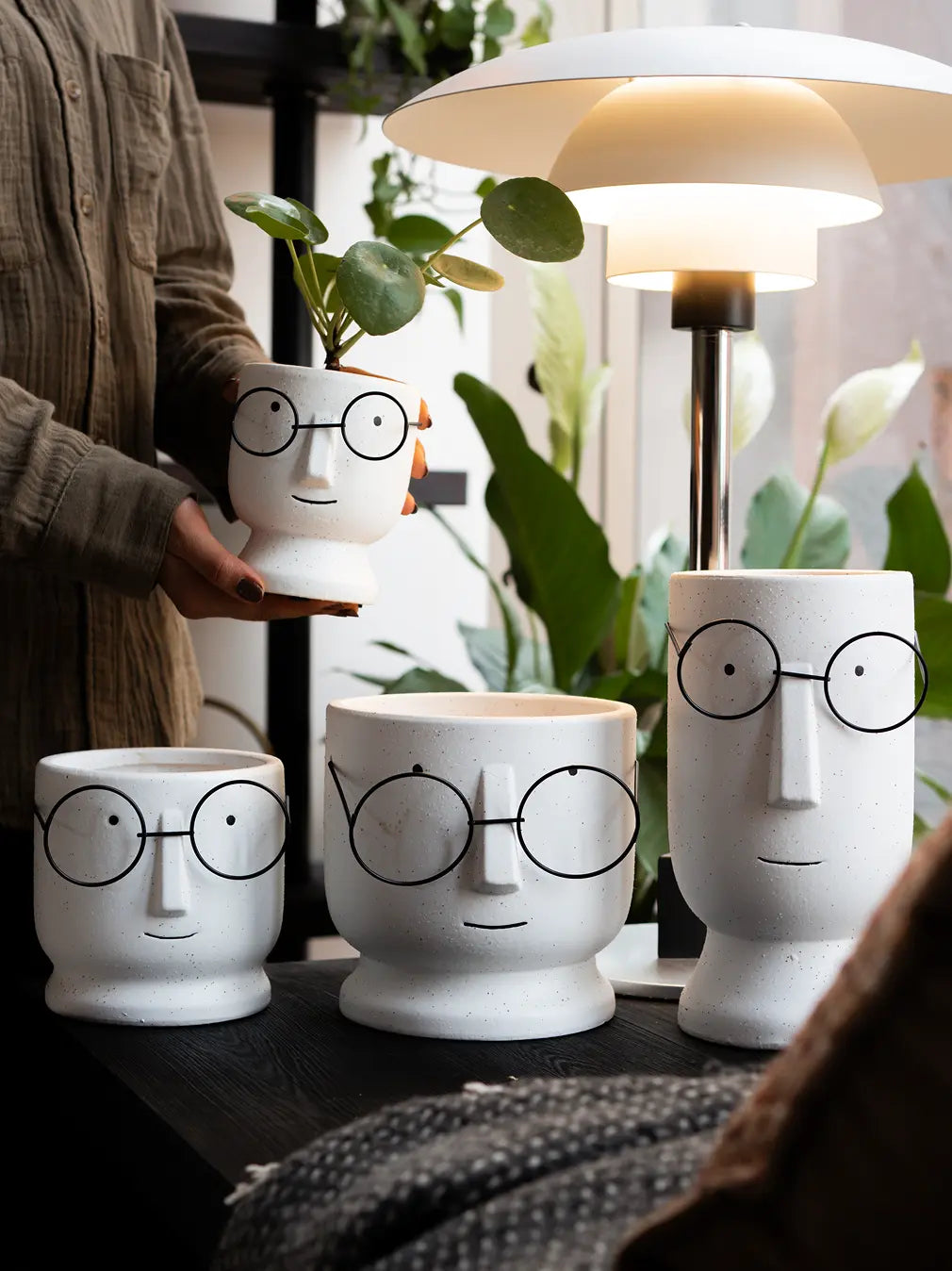 Modern white ceramic planter in four sizes with grainy texture and minimalist face design