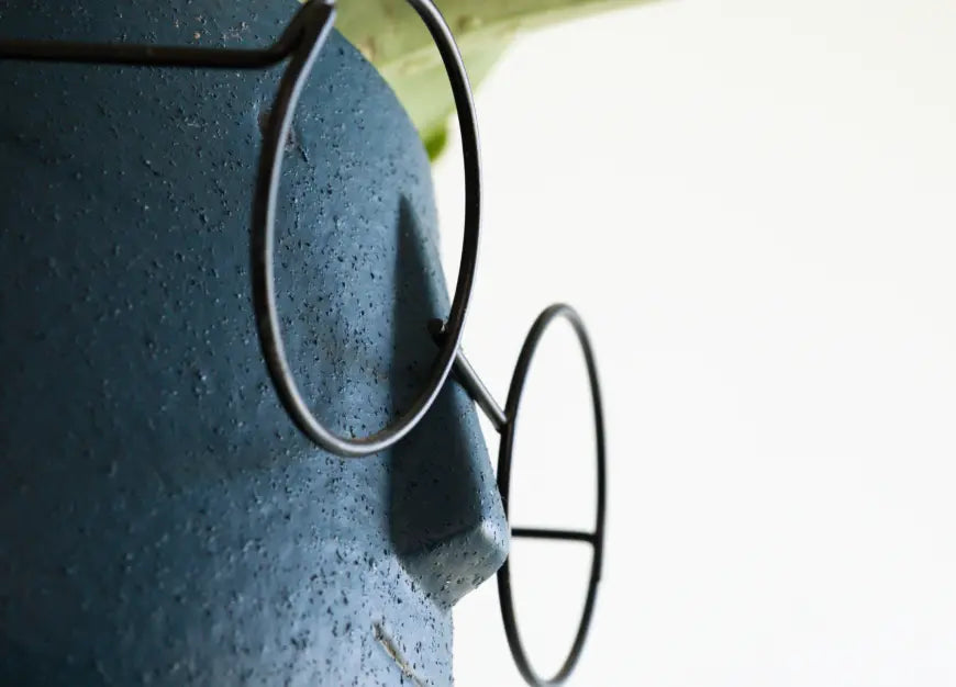 Close-up of the Jojo Ceramic Planter, highlighting its textured ceramic surface and detailed facial features.