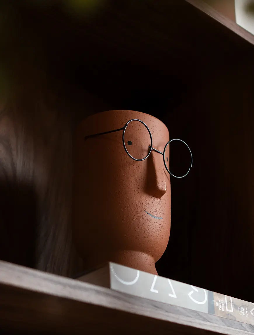 Jojo Brown ceramic planter styled on shelf, adding warmth to modern home decor