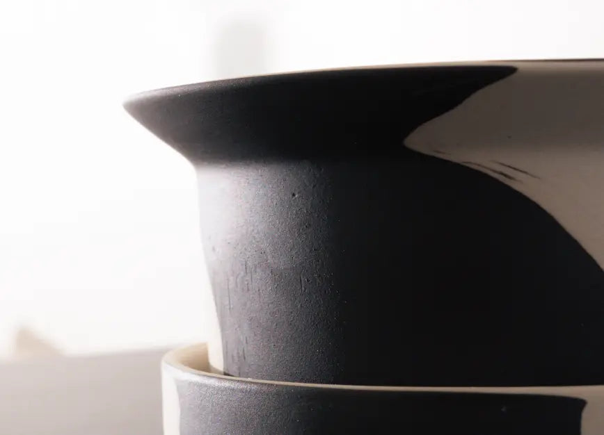 Matte black and white ceramic planter texture highlighting premium craftsmanship