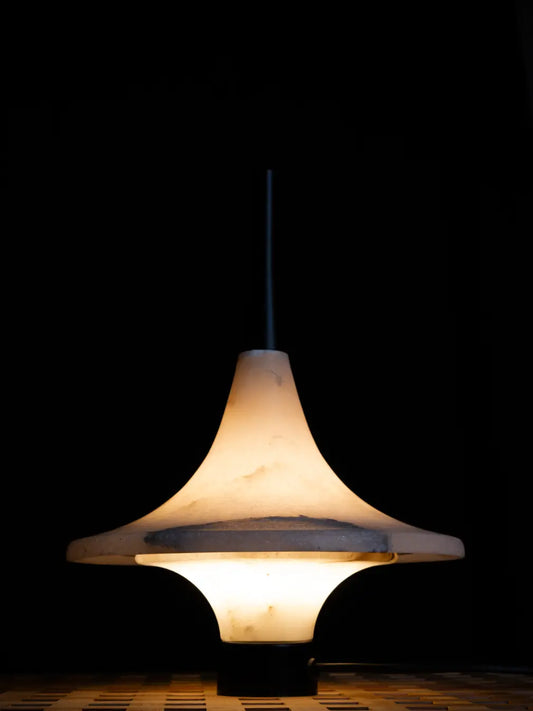 Premium Lattu Marble Table Lamp glowing in dark setting