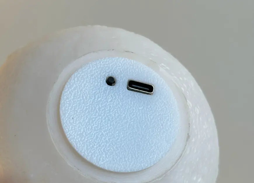 Bottom view of Lop portable table lamp with Type-C charging port and control button