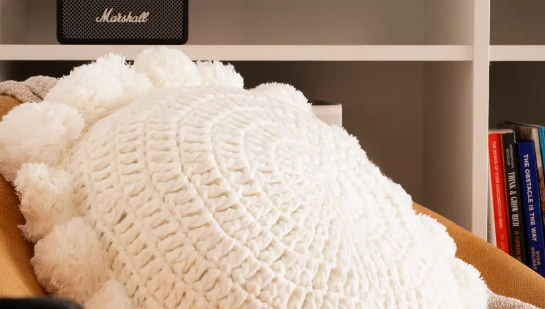 White textured cushion placed on chair