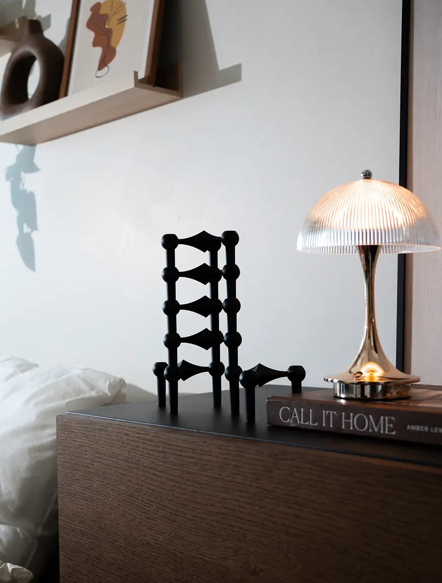 Modern black taper candle stands styled for elegant console table decor