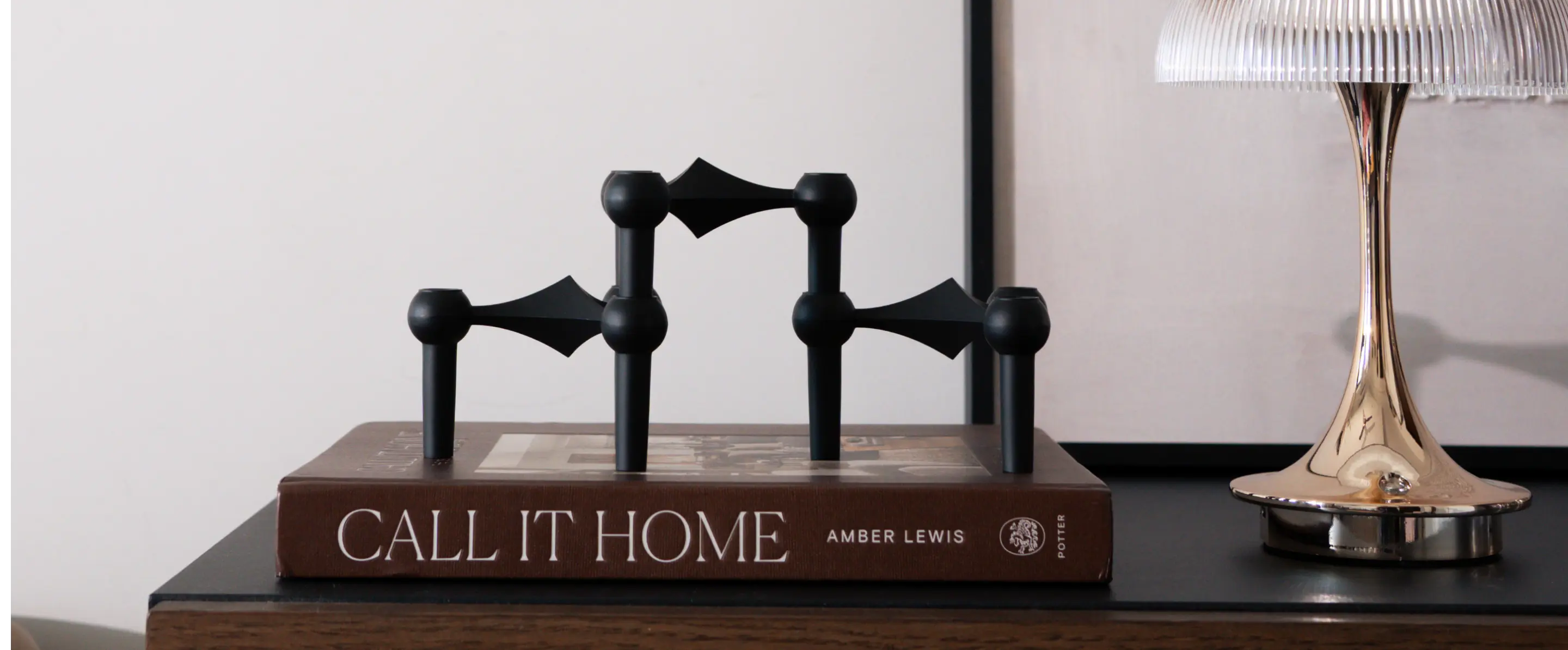 Modern modular candle holder styled on coffee table with ambient lighting