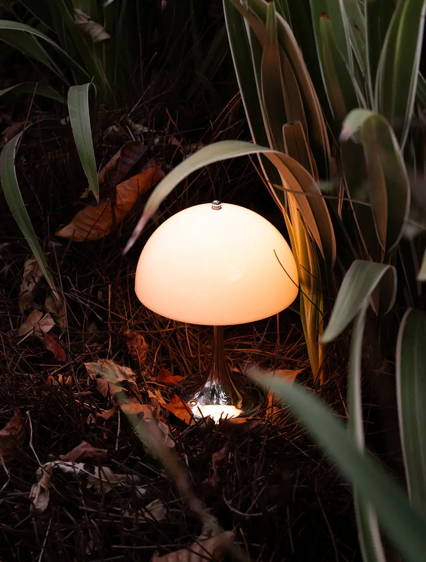 Nova Designer mushroom lamp styled outdoors with warm ambient glow