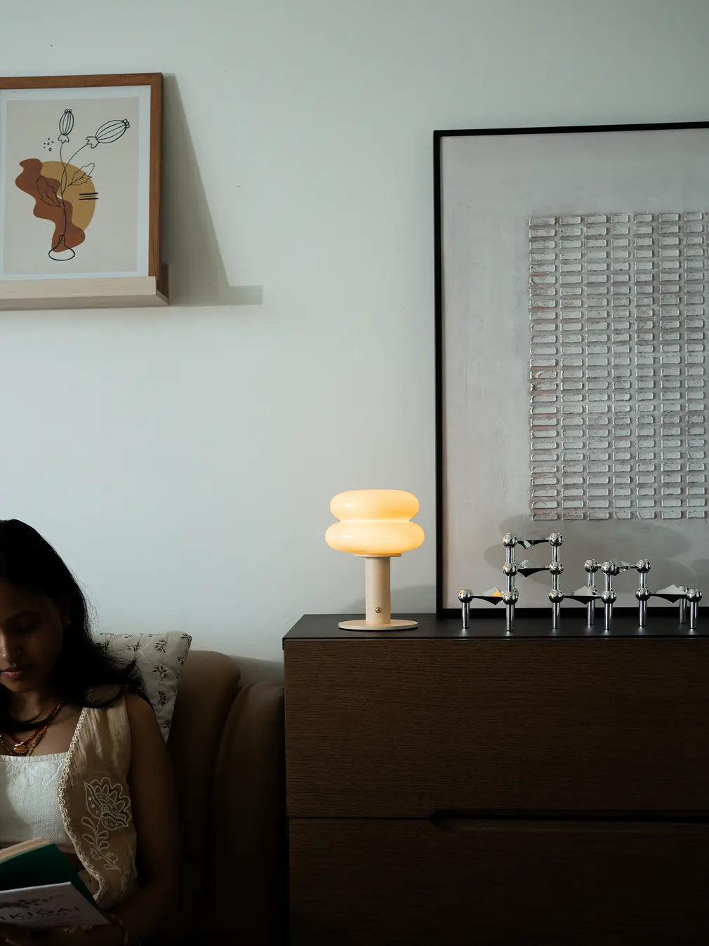 Modern wireless lamp styled on bedside cabinet with ambient warm lighting