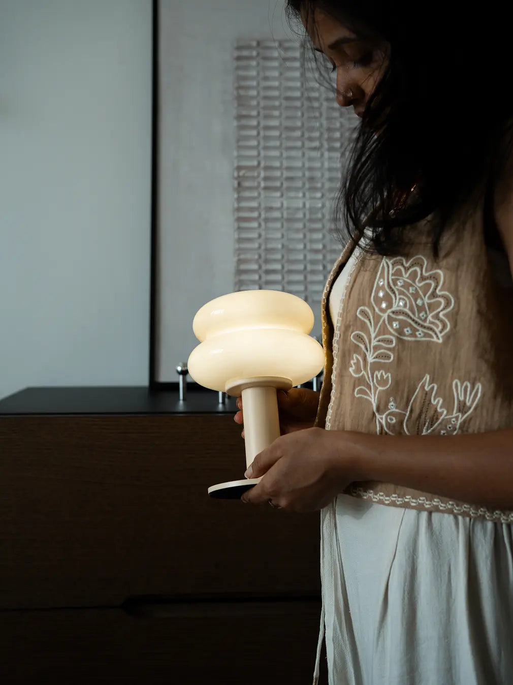 Rechargeable portable lamp with layered glass shade and touch dimming feature